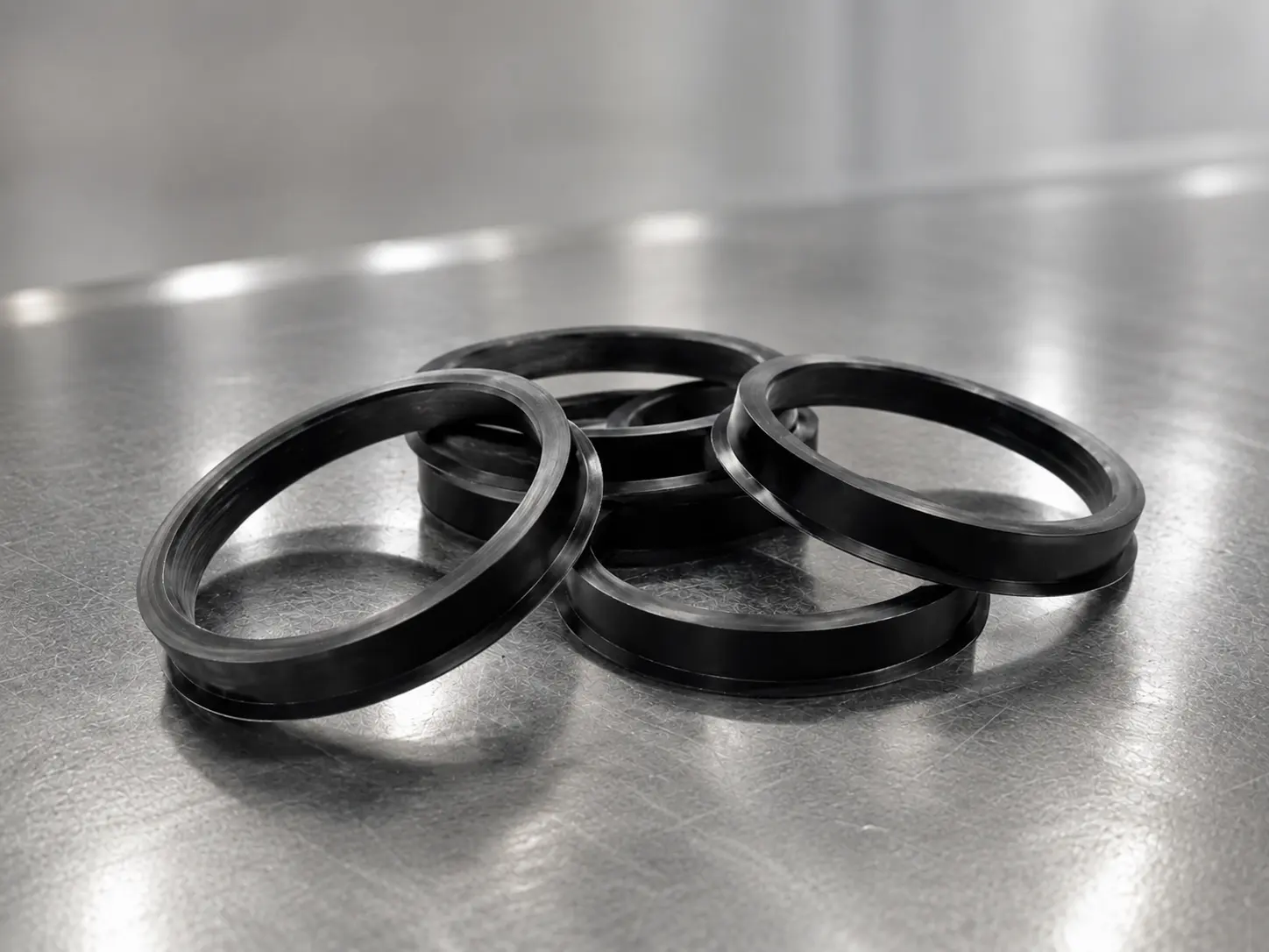 VNOX black hub-centric centering rings on a metal surface
