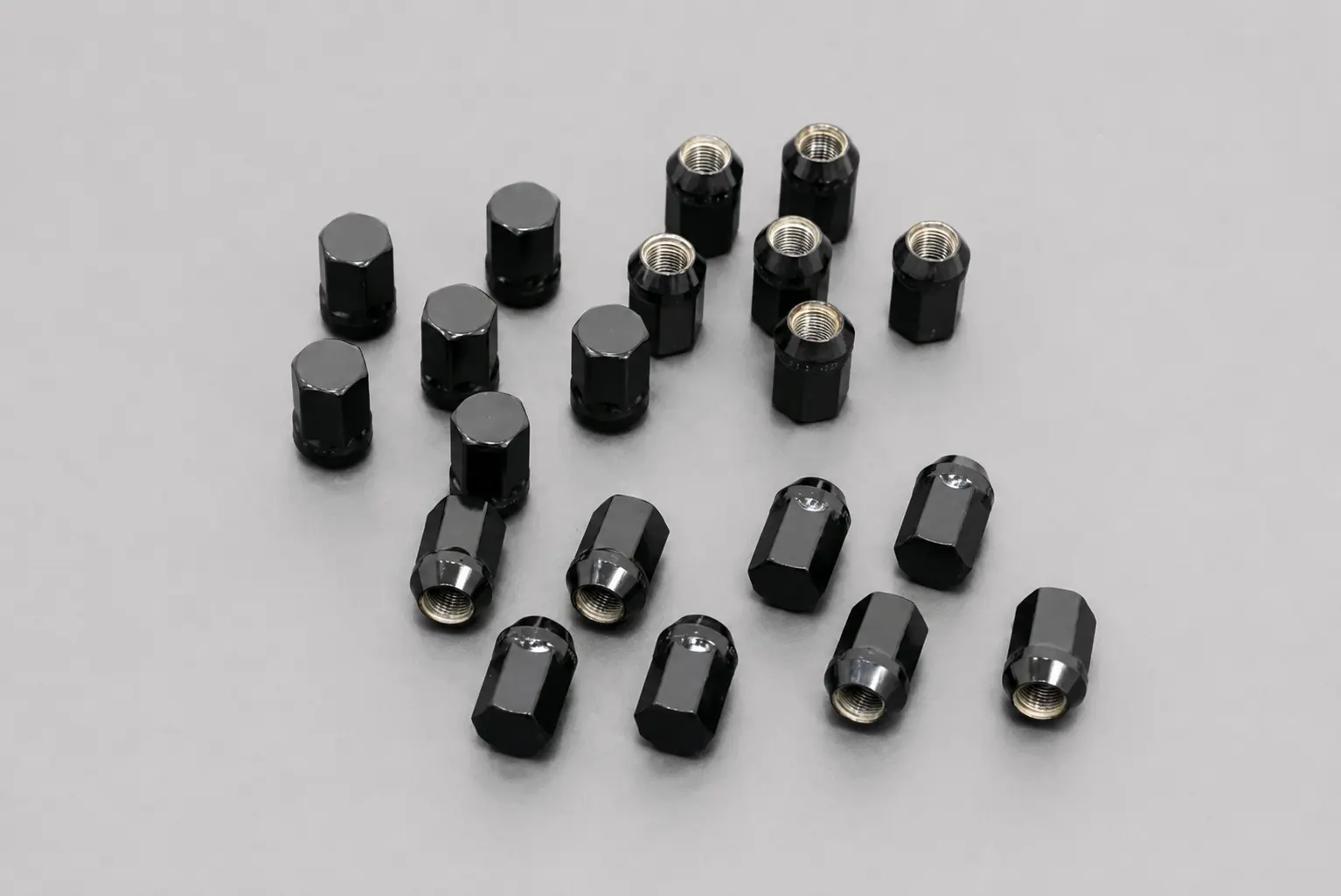 VNOX forged lug nuts and bolts on a dark metal surface